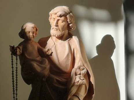 Photo by Massimo Filigura: https://www.pexels.com/photo/a-statue-of-a-man-carrying-a-baby-10632921/
